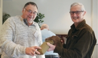 Ken Barnes and Murray Stevenson with a hare dummy used for training gun dogs