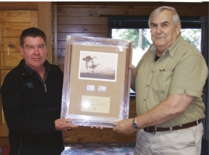 Ian’s reward: Andy Garrick CEO of Eastern Fish &amp;Game (left) and DU Life Member Ian Pirani; has also been recognised for his long involvement with Eastern F&amp;G. The inscription says: In recognition of your long term dedication and commitment to the conservation and management of New Zealand’s water fowl and their wetland habitats.